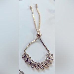 Dainty gold tone and white gemstone